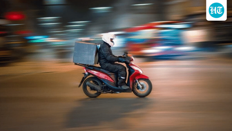 Delivery man falls from bike in waterlogged street, locals rush to help: ‘Be kind to them’